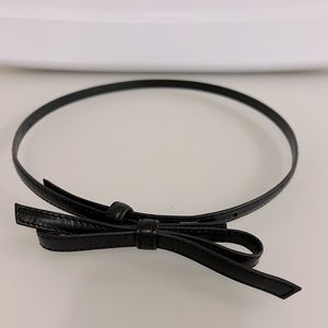 Belt by Saks Fifth Avenue. Classic black belt with bow closure. Size S.